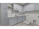 Well-equipped laundry room with ample cabinet space and light blue walls at 4501 Bartlett Dr, Raleigh, NC 27609