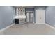 Stylish living area with elegant cabinetry, wine storage, and soft blue walls at 4501 Bartlett Dr, Raleigh, NC 27609