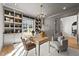 Serene home office featuring custom built-ins, natural light, and comfortable seating at 4501 Bartlett Dr, Raleigh, NC 27609