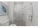 Bathroom with a white vanity, framed art and a marble tiled shower with glass enclosure at 4501 Bartlett Dr, Raleigh, NC 27609