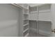 Spacious walk-in closet featuring custom shelving and ample hanging space at 4501 Bartlett Dr, Raleigh, NC 27609