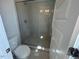 Tiled shower and toilet at 500 Yeowell Dr, Chapel Hill, NC 27514