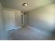 Bedroom in progress with gray walls and ample natural light at 500 Yeowell Dr, Chapel Hill, NC 27514