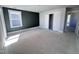 Unfinished bedroom featuring a dark accent wall and double doors, ready for your personal touches at 500 Yeowell Dr, Chapel Hill, NC 27514