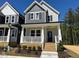 Charming two-story home featuring a welcoming front porch and modern architectural details at 500 Yeowell Dr, Chapel Hill, NC 27514