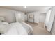Cozy bedroom boasts neutral tones, plush carpet, and ample closet space with sliding doors for organized storage at 500 Yeowell Dr, Chapel Hill, NC 27514