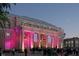 Exterior of Memorial Hall with stately columns and lit for an evening event at 500 Yeowell Dr, Chapel Hill, NC 27514