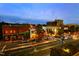 Street view of a vibrant downtown area with shops, restaurants, and vehicle traffic at 500 Yeowell Dr, Chapel Hill, NC 27514