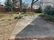 Relaxing backyard with two benches and a concrete pad perfect for enjoying the outdoors at 531 N Main St, Graham, NC 27253