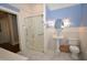 Bathroom featuring glass shower, pedestal sink, tiled wainscoting, and marble floors at 531 N Main St, Graham, NC 27253
