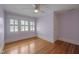 Bedroom with hardwood floors, neutral paint, and bright natural light at 531 N Main St, Graham, NC 27253