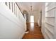 Foyer with staircase, hardwood floors, and archway to another room at 531 N Main St, Graham, NC 27253