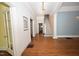 Spacious foyer with staircase and hardwood floors, bathed in natural light at 531 N Main St, Graham, NC 27253