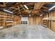 Spacious unfinished garage with ample storage space and exposed rafters at 531 N Main St, Graham, NC 27253