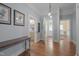 Inviting foyer with hardwood floors and multiple rooms off of hallway at 531 N Main St, Graham, NC 27253