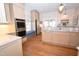 Bright eat-in kitchen with stainless steel appliances, granite countertops, and a cozy window seat at 531 N Main St, Graham, NC 27253
