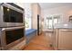 Modern eat-in kitchen with stainless steel appliances, granite countertops, and hardwood flooring at 531 N Main St, Graham, NC 27253