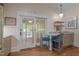 Bright kitchen featuring a breakfast bar, sliding glass door, and granite countertops at 531 N Main St, Graham, NC 27253