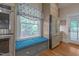 Bright kitchen featuring a window seat, stainless steel refrigerator, and stainless steel oven at 531 N Main St, Graham, NC 27253