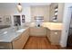 Updated kitchen with granite countertops, stainless appliances, and hardwood flooring at 531 N Main St, Graham, NC 27253