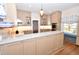 Bright kitchen featuring a large island with stone countertop at 531 N Main St, Graham, NC 27253