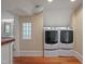 Convenient laundry room area featuring modern washer and dryer units at 531 N Main St, Graham, NC 27253