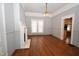 Inviting living room with hardwood floors, fireplace, and large window at 531 N Main St, Graham, NC 27253