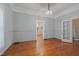 Living room featuring hardwood floors and views to kitchen and sunroom at 531 N Main St, Graham, NC 27253