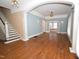 Spacious living room with hardwood floors and elegant archways at 531 N Main St, Graham, NC 27253