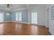 Bright, spacious living room with hardwood floors and classic architectural details at 531 N Main St, Graham, NC 27253