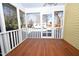 Screened in porch with wood floors and view of backyard at 531 N Main St, Graham, NC 27253