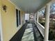 Inviting front porch with classic columns and porch swing for relaxing outdoors at 531 N Main St, Graham, NC 27253
