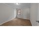 This bedroom has fresh paint, luxury vinyl flooring, and neutral colors at 5400 Cedarwood Dr, Raleigh, NC 27609