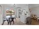 Bright breakfast nook with modern pendant lighting, and a view of the backyard through sliding glass doors at 5400 Cedarwood Dr, Raleigh, NC 27609