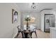 Breakfast nook with modern lighting, stainless steel appliances, and sliding glass doors to the backyard at 5400 Cedarwood Dr, Raleigh, NC 27609