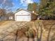 A charming one-story home featuring a wide driveway and attached two car garage at 5400 Cedarwood Dr, Raleigh, NC 27609