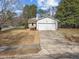 Charming one-story home featuring a wide driveway and attached two car garage at 5400 Cedarwood Dr, Raleigh, NC 27609