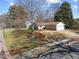 A charming one story home with a well-manicured lawn and mature trees at 5400 Cedarwood Dr, Raleigh, NC 27609