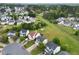 Establishing aerial shot showcases the homes in a lush community at 6013 Shelane Ct, Raleigh, NC 27610