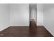 Bedroom with wood look flooring, neutral walls, and an open door to a closet at 6013 Shelane Ct, Raleigh, NC 27610