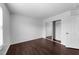 Bright bedroom features gleaming wood floors and mirrored closet doors at 6013 Shelane Ct, Raleigh, NC 27610