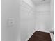 Walk-in closet with wire shelving and dark wood floors at 6013 Shelane Ct, Raleigh, NC 27610