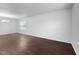 Open and airy room with neutral walls, light-filled windows, and sleek flooring at 6013 Shelane Ct, Raleigh, NC 27610