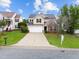 Inviting two-story home with a well-kept lawn, long driveway, and traditional architecture at 6013 Shelane Ct, Raleigh, NC 27610