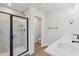 Bright bathroom featuring a glass shower, dual sink vanity, and modern fixtures at 624 Brittany Ct, Durham, NC 27703