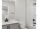 Bathroom with a single sink vanity, toilet, and shower-tub combination at 624 Brittany Ct, Durham, NC 27703