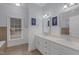 Bathroom features double sinks, tile flooring, and picture window overlooking the backyard at 6709 Windchase Dr, Rocky Mount, NC 27803