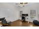 Bedroom featuring hardwood floor, ceiling fan, and two windows at 6709 Windchase Dr, Rocky Mount, NC 27803