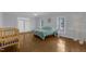 Bedroom with hardwood floors, bright natural light and a ceiling fan at 6709 Windchase Dr, Rocky Mount, NC 27803