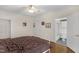 Bedroom featuring hardwood floors with attached bath and walk-in shower at 6709 Windchase Dr, Rocky Mount, NC 27803